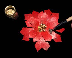 Bild von Weihnachtsstern mit Goldpulver