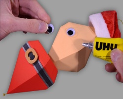 Augen auf Nikolaus-Christbaumkugel kleben Bild vom Aufkleben der Augen auf Nikolaus Christbaumkugel