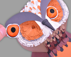 Einkleben der Fimo Augen in den Eulenkopf