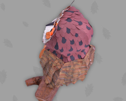 Bild von der Rückseite eines Bubos aus Papier auf einem Ast