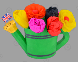 Grüne Gießkanne im Haws-Design, in der farbenfrohe Tulpen stecken Picture of green Haws watering can from England. Crafted by Veronika Vetter Bavarian Fine Artist