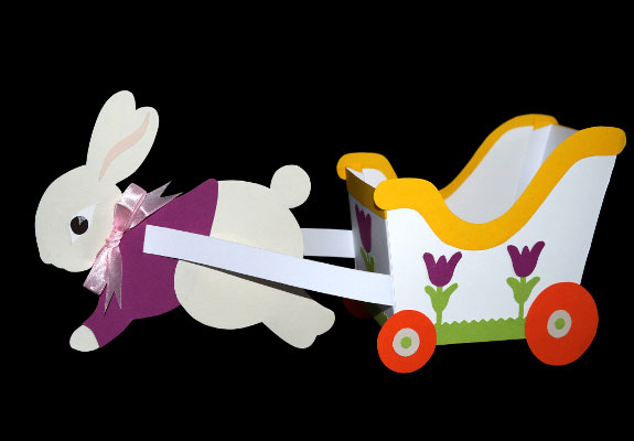 Bild von einem Papierosterhasen der eine Kutsche zieht