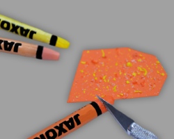 Bunte Wachsmalkreide auf Tonpapier schaben Bild vom Abschaben der Wachsmalkride mithilfe eines Bastelmessers
