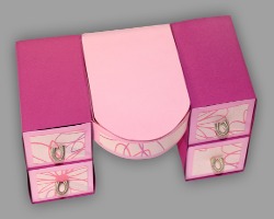 Bild von kleiner pinker Papierkommode