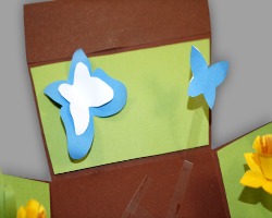 Bilder von Schmetterlingen auf einer Osterwiese aus Papier