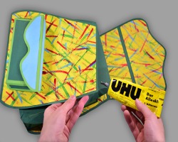 Zusammenkleben der Papierschultasche Bild vom Zusammenkleben der Papierschultasche