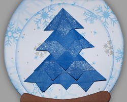 Bild von einem blauem Tannenbaum der auf eine Schneekugel geklebt wurde